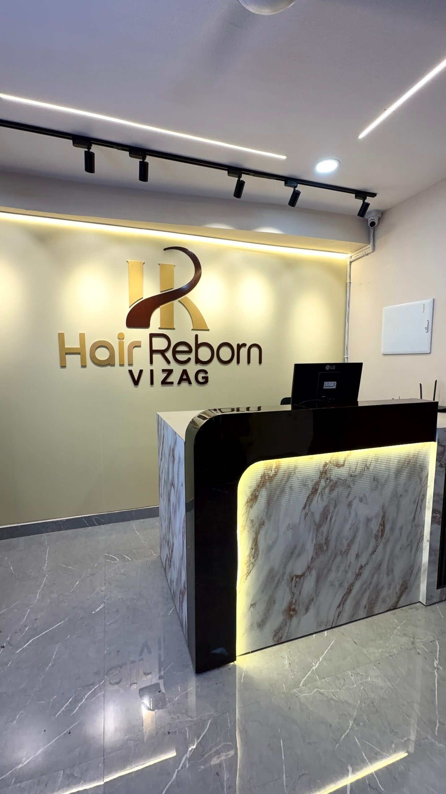 Doctor in consultation with a hair loss patient at Hair Reborn, Vizag